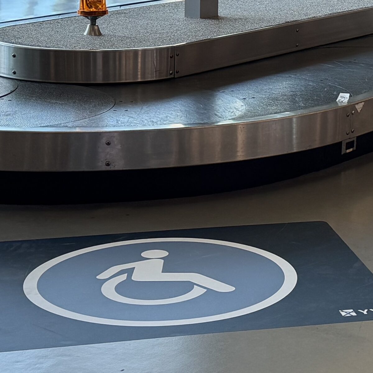Decal at luggage carousel.