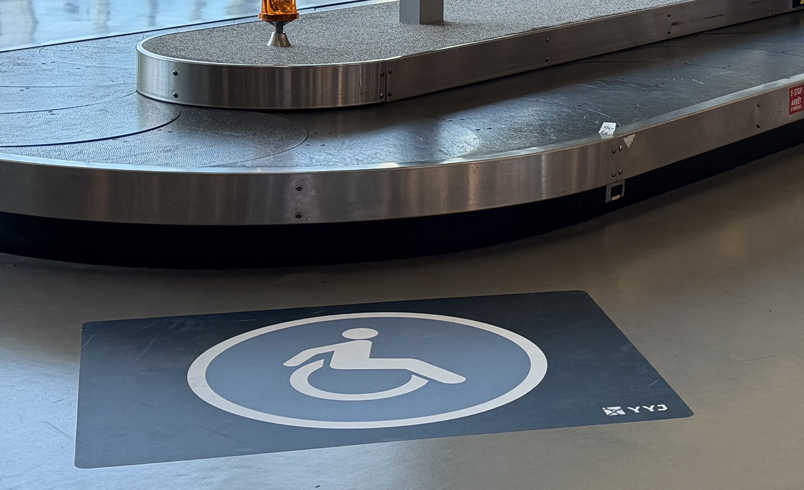 Decal at luggage carousel.
